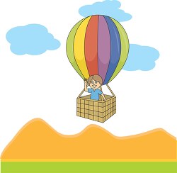 boy flying over hills in a hot balloon