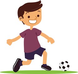 young boy that is kicking a soccer ball
